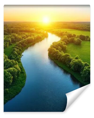 Aerial view of a river flowing through lush green fields at sunset.