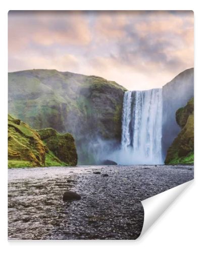 Famous Skogafoss waterfall on Skoga river in sunrise time