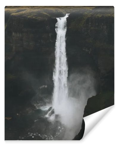 dramatic Haifoss waterfall and rocky cliff, Iceland