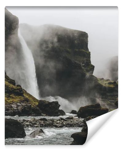 beautiful icelandic landscape with Haifoss waterfall on misty day