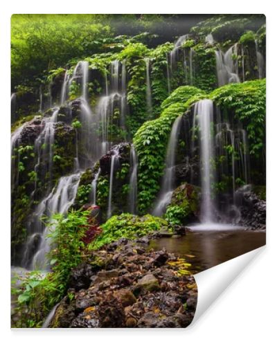 Tropical landscape. Beautiful hidden waterfall in rainforest. Adventure and travel concept. Nature background. Slow shutter speed, motion photography. Banyu Wana Amertha waterfall Bali, Indonesia