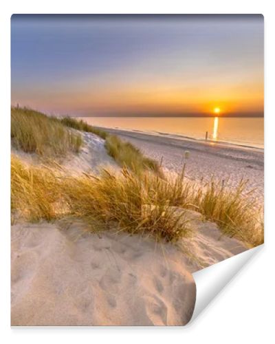 Sunset View over ocean from dune over North Sea and Canal in Ouddorp, Zeeland Province, the Netherlands. Outdoor scene of coast in nature of Europe.