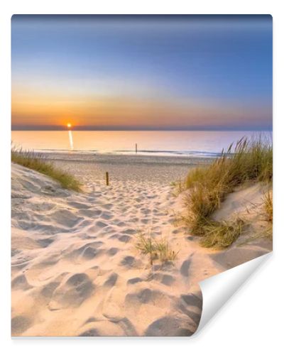 Inviting Sunset View over ocean from dune over North Sea and Canal in Ouddorp, Zeeland Province, the Netherlands. Outdoor scene of coast in nature of Europe.