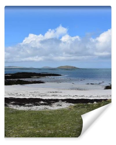 Beautiful sandy beach with coastal dunes on the remote island of South Uist in the Outer Hebrides of Scotland.