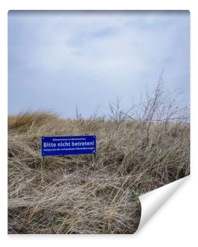 Norddeich, Germany.  March 24, 2026. Landscape scene at the Northsea coast in East Frisia. Lettering in German which means -Probibited to walk on the dunes- . Editorial and documentary use only