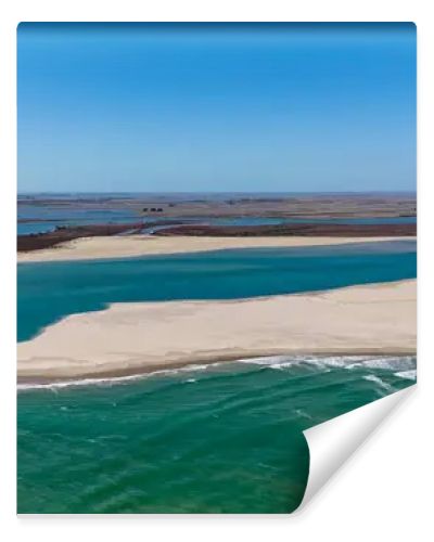 Coorong National Park in South Australia is a coastal wilderness renowned for its vast lagoon system, sand dunes, and pristine natural beauty. This aerial drone footage captures the striking contrast between turquoise waters, winding estuarine
