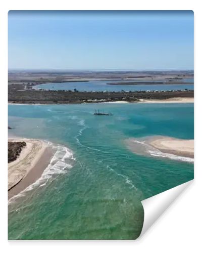 Coorong National Park in South Australia is a coastal wilderness renowned for its vast lagoon system, sand dunes, and pristine natural beauty. This aerial drone footage captures the striking contrast between turquoise waters, winding estuarine