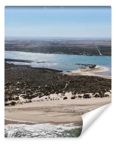 Coorong National Park in South Australia is a coastal wilderness renowned for its vast lagoon system, sand dunes, and pristine natural beauty. This aerial drone footage captures the striking contrast between turquoise waters, winding estuarine
