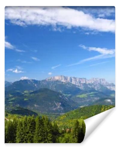 Scenic view of mountains, forests and blue sky