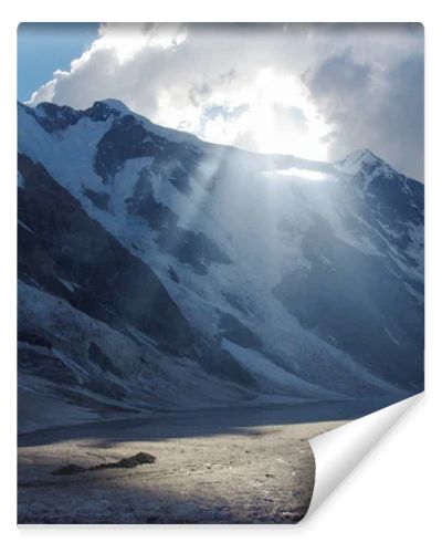 mountains and cloudy sky with sunlight