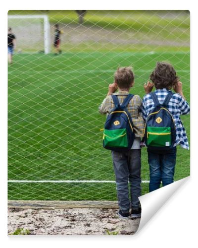 schoolboys on soccer field 