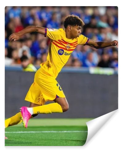 Madrid, Spain- August 13, 2023: Soccer match between Getafe FC and Barcelona FC of the Spanish EA Sports league. Lamine Yamal with the ball. Football players.