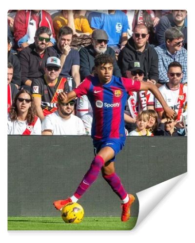 Madrid, Spain- November 25, 2023: League match between Rayo Vallecano and F.C Barcelona in Madrid. Lamine Yamal with the ball. Football players.