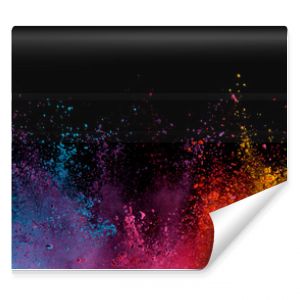 Explosion of colored powder on black background