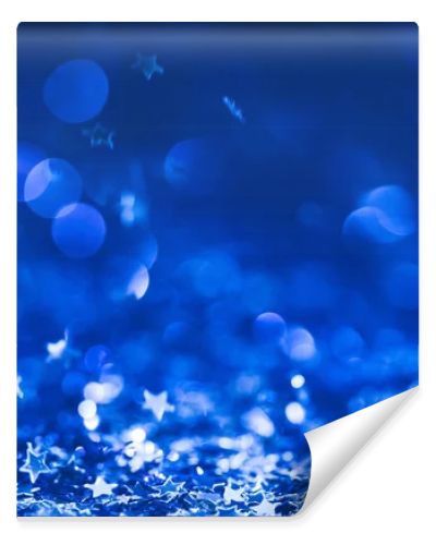 christmas background with falling blue shiny confetti stars