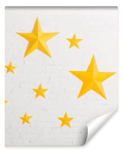 Yellow cardboard stars on light textured background