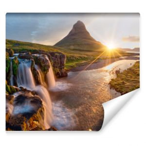 Beautiful landscape with sunrise on Kirkjufellsfoss waterfall and Kirkjufell mountain, Iceland, Europe.