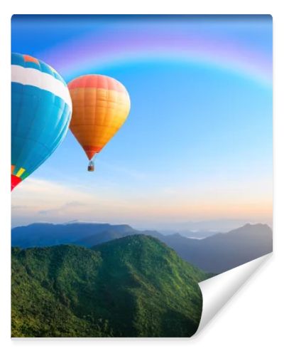 Colorful hot-air balloons flying over the mountain