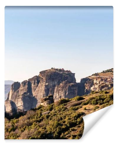 rock formations with monastery near mountains in meteora 