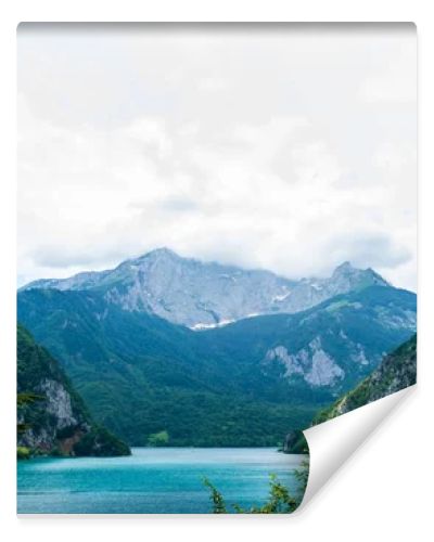 beautiful Piva Lake, mountains and cloudy sky in Montenegro