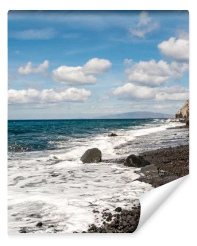 blue aegean sea near rocks against sky with clouds 