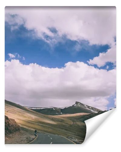 motorcyclist on mountain road in Indian Himalayas, Ladakh region