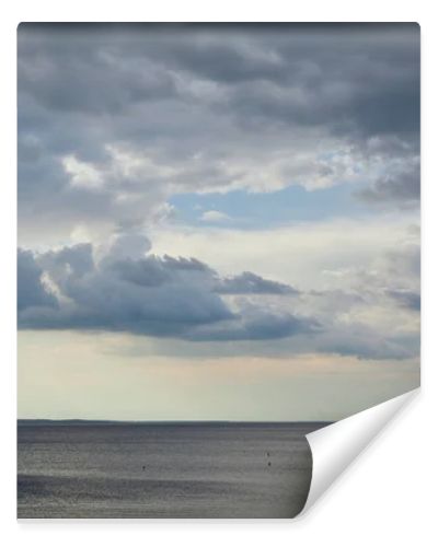 Overcast weather with clouds on blue sky over river coastline