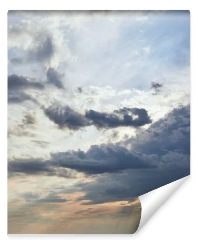 dark clouds and sun rays on blue sky background