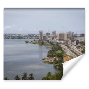 Abidjan, the economical capital of Ivory Coast (Cote d'Ivoire), it's business area Plateau with the Atlantic ocean bay in the background. April 2013