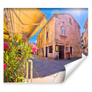 Sunny stone street of ancient Pula view