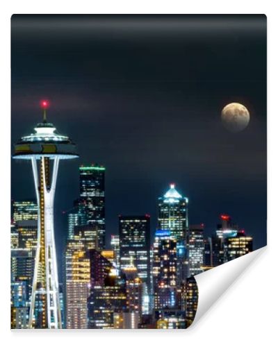 Full moon rises above Seattle skyline, as viewed by night from Kerry Park.