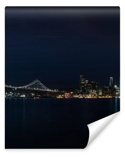 Light illuminates the beautiful Northern California city of San Francisco at night. This scenic, modern metropolis is located on the edge of the Pacific Ocean and just west of the city of Oakland.