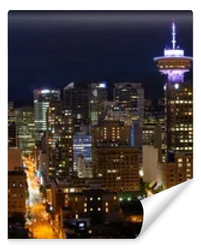 Beautiful panoramic view of the modern cityscape from an aerial perspective at night. Taken in Downtown Vancouver, BC, Canada.