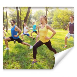 Group of young people training in park