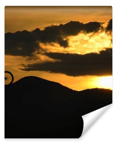 Silhouette of biker at sunset