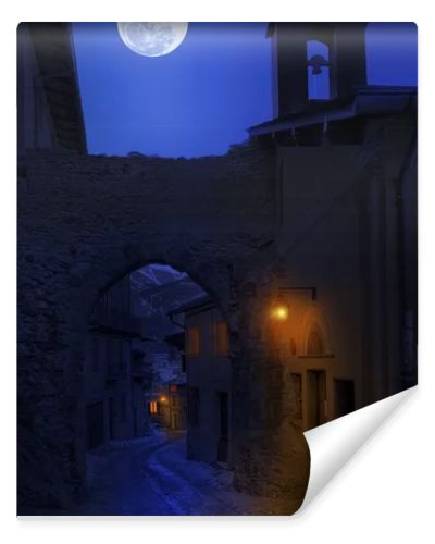 Night view of narrow street in small town.
