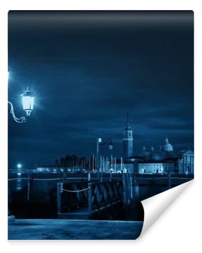 Venice at night with street lamp and San Giorgio Maggiore church in Italy.