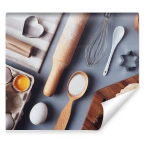 Flat layout composition, baking ingredients and kitchen utensils on a gray background. Culinary trendy background. The concept of making homemade desserts for the holiday