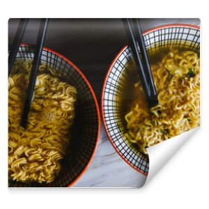 Instant pasta, Japanese and Chinese noodles. Ramen type soup in a plate with chopsticks, junk fast food. Quick-cooking pasta.