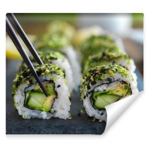 healthy kale and avocado sushi roll with chopsticks