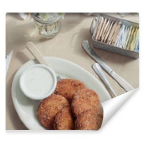 Country style fried green tomatoes on inside of a restaurant