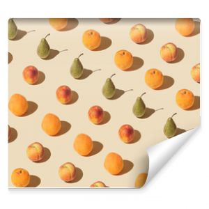 Pattern of colorful fruits on a pastel background. Composition with fresh raw tropical fruit.