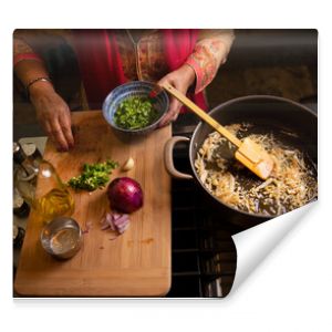 Indian woman's hands working in the kitchen preparing food