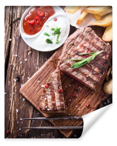 Beef steak on wooden table