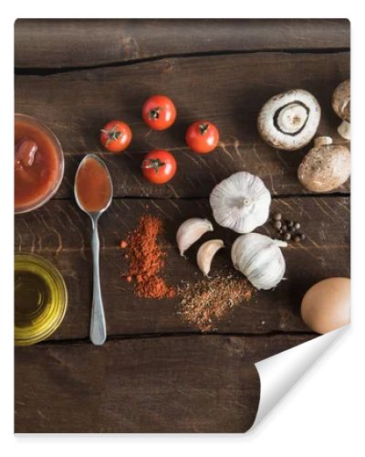 ingredients for preparing pizza on wooden tabletop