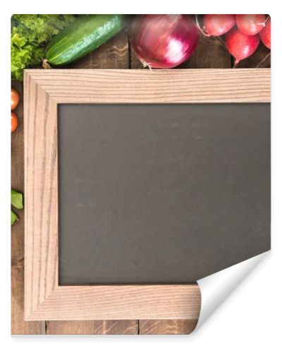 chalkboard with group of fresh vegetables 