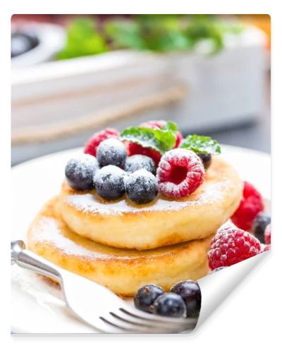 Cottage cheese pancakes, syrniki, curd fritters with berries