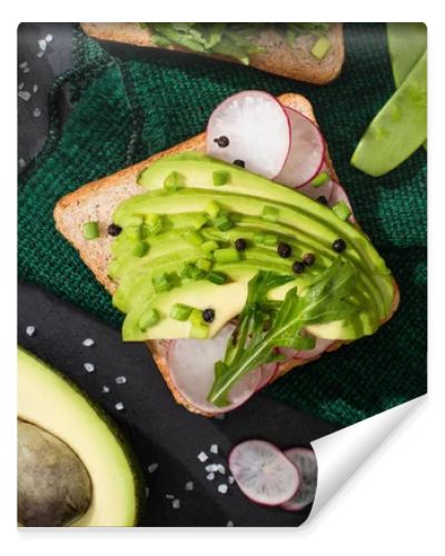 top view of vegetarian sandwiches with fresh vegetables green cloth