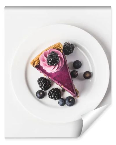 top view of blueberry cake with fresh berries on plate isolated on white