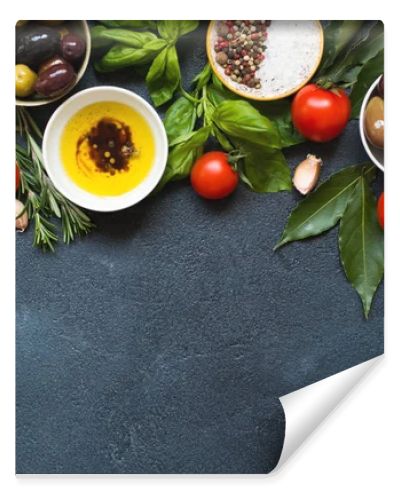 Olives and olive oil on dark stone
